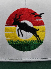Dub Like an Antelope Donut Sunset on a Green and White Snapback Trucker Hat
