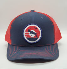 Antelope Donut Sunset Patch on a Navy Blue and Red Snapback Trucker Hat