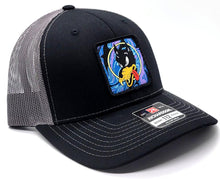 Wolf Psychedelic Drip Patch on a Black and Charcoal Richardson Trucker Hat